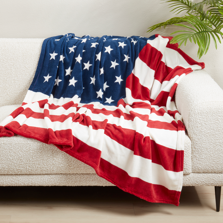 American Flag decorative throw on a white couch